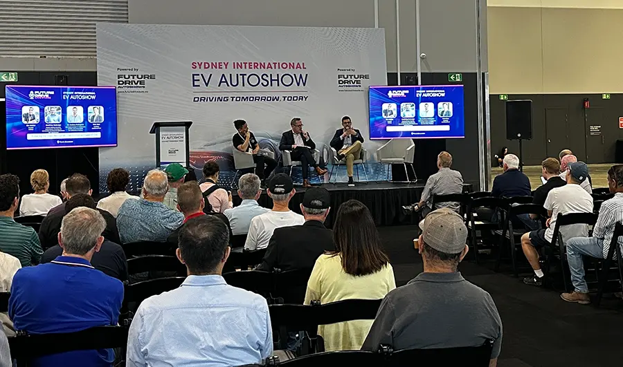 Visitors exploring vehicles at an Australian auto show.